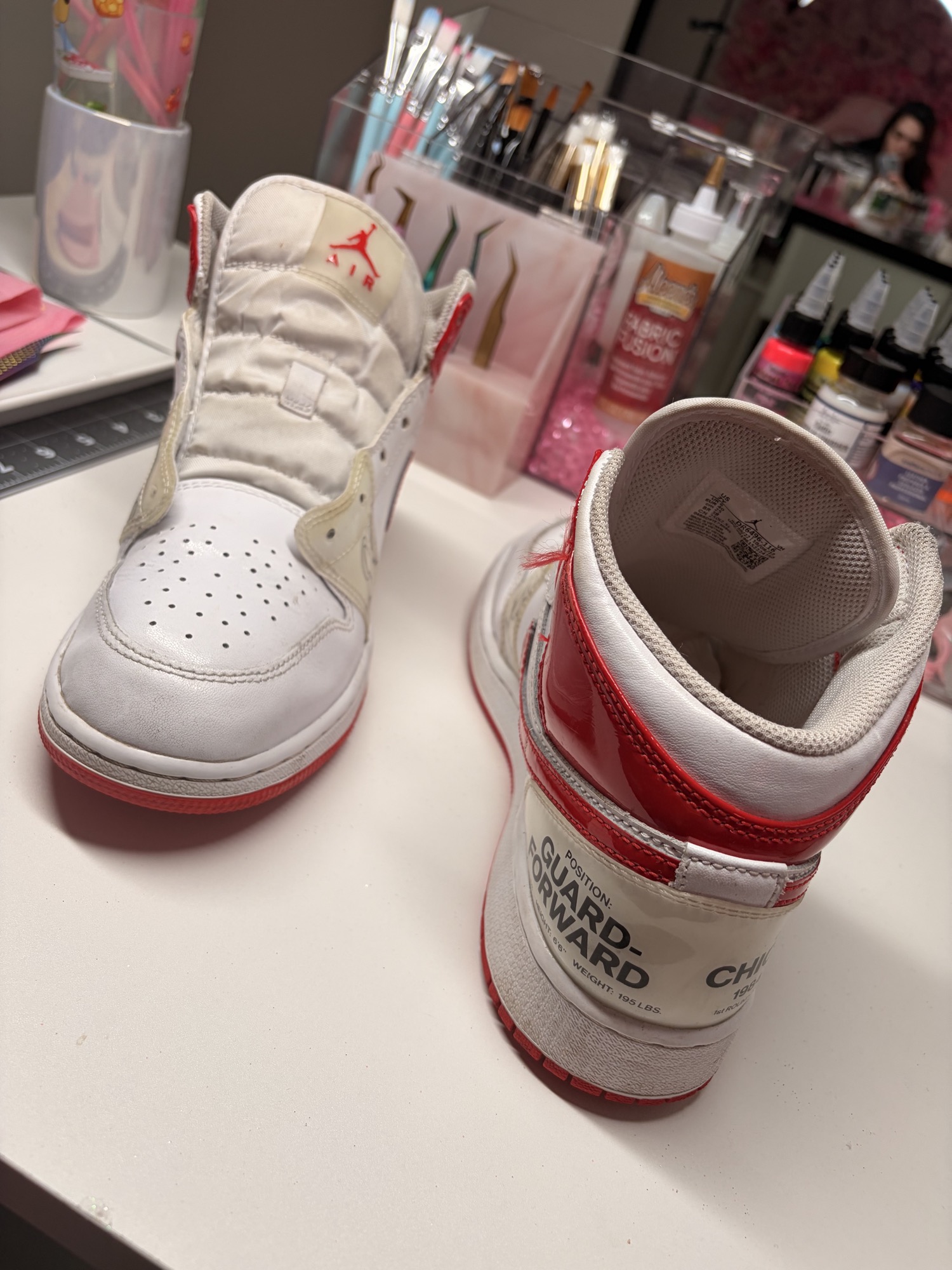 Tongues and heel details on the Chicago-inspired sneakers without laces before restoration