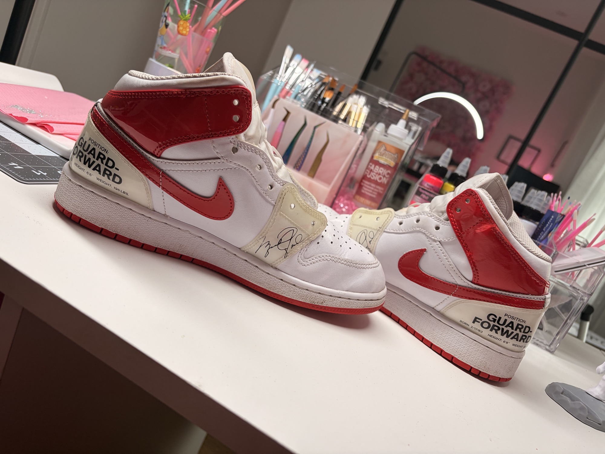 Marked red patent panels on the Chicago-inspired sneakers without laces before restoration